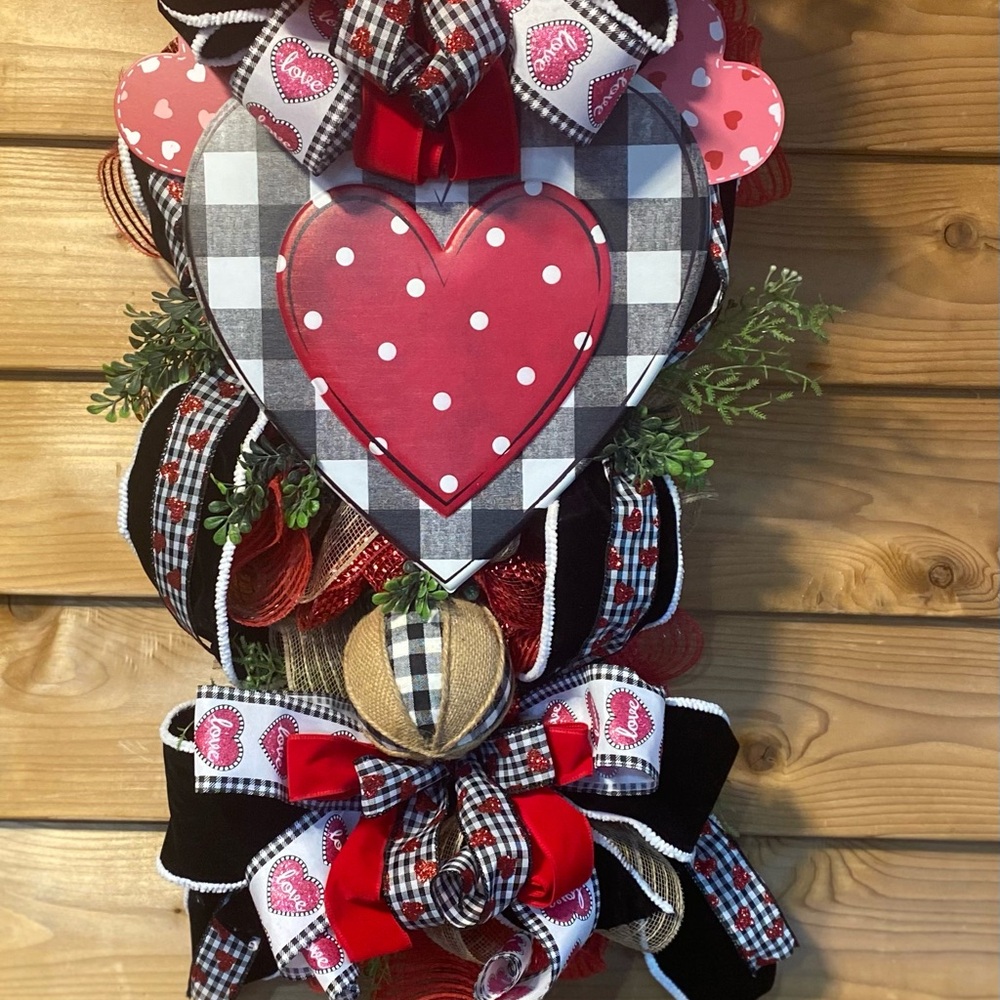 Heart-Themed Holiday Wreath with Red and Black Accents